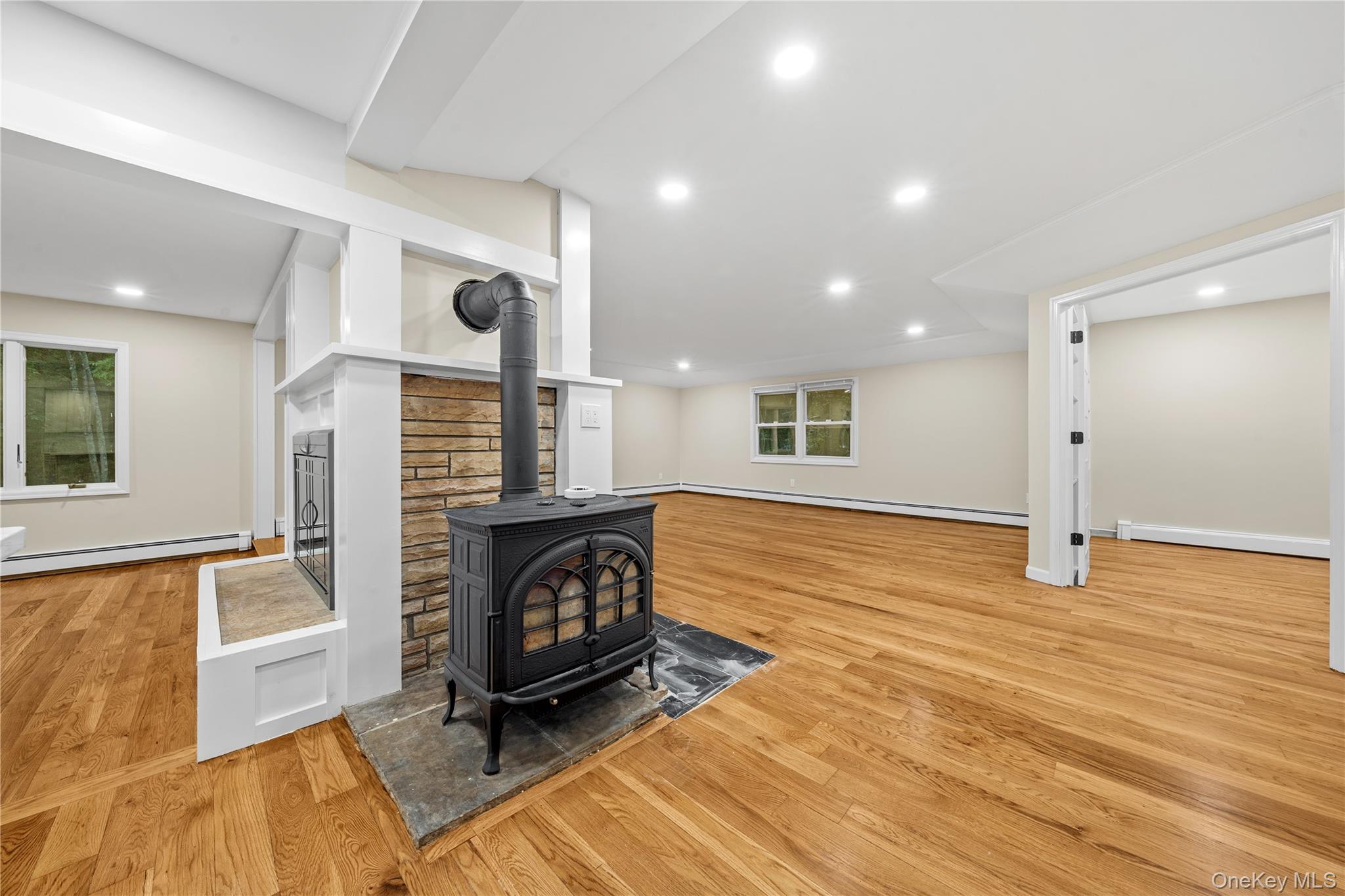 57 Eastwood Road Miller Place, NY 11764 - Photo 9 of 49 a view of a livingroom with furniture and a fireplace