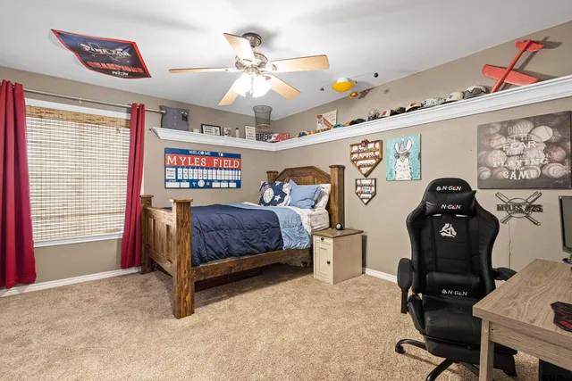 a bedroom with furniture and a window