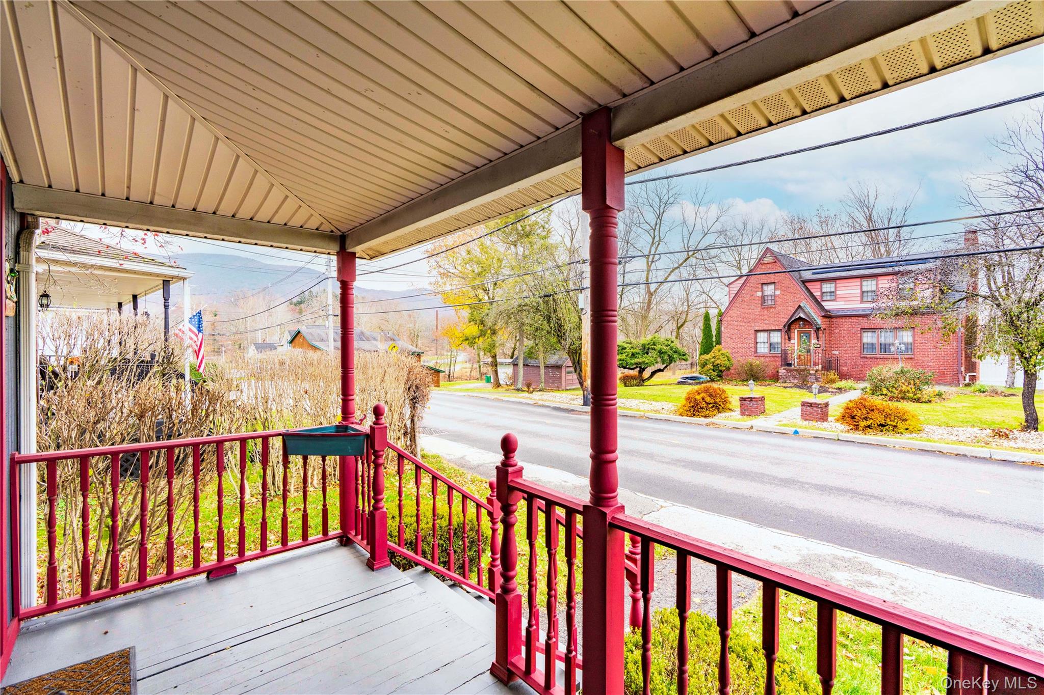 9 Maple Street Fishkill, NY 12524 - Photo 3 of 14 Full covered front porch with distant mountain views. 2 minutes from a town park w stream