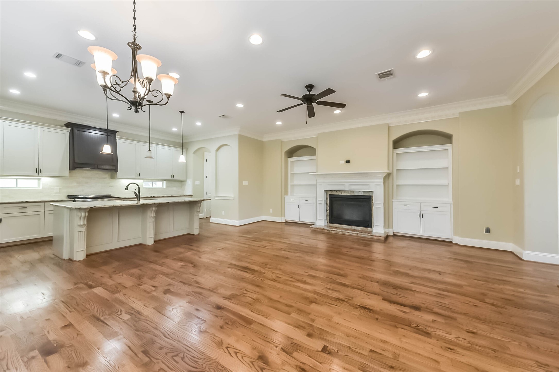 1126 West 16th Street, Unit C Houston, TX 77008 - Photo 12 of 44 a view of a kitchen with a sink dishwasher a fireplace with a dining table and chairs