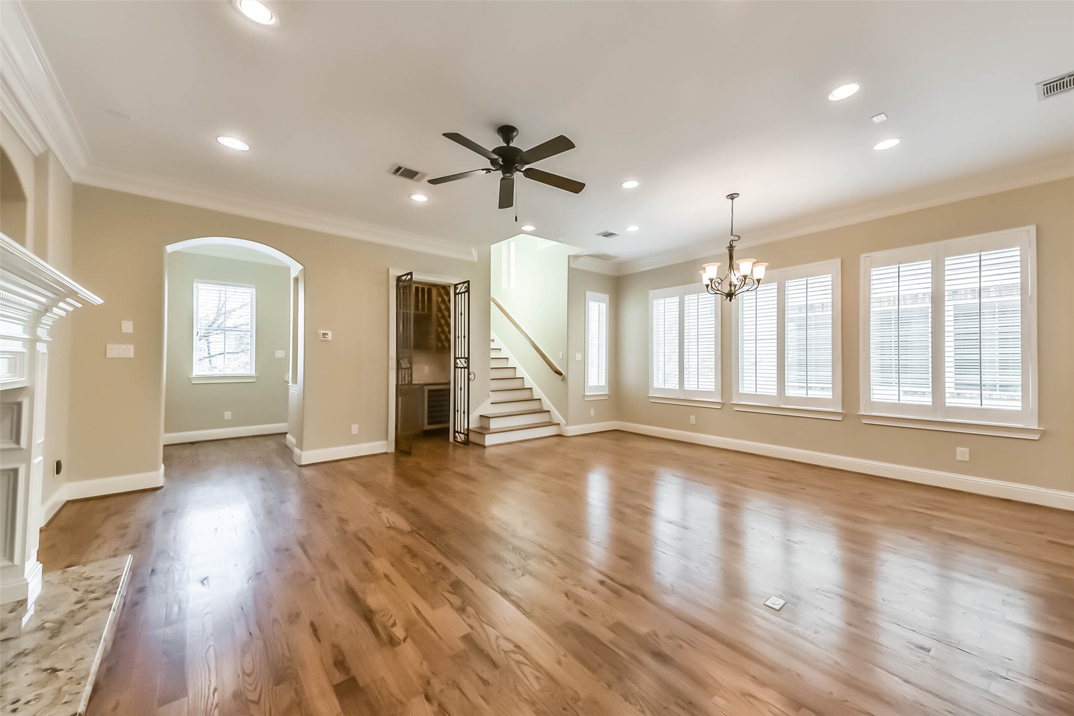 1126 West 16th Street, Unit C Houston, TX 77008 - Photo 14 of 44 an empty room with wooden floor and windows