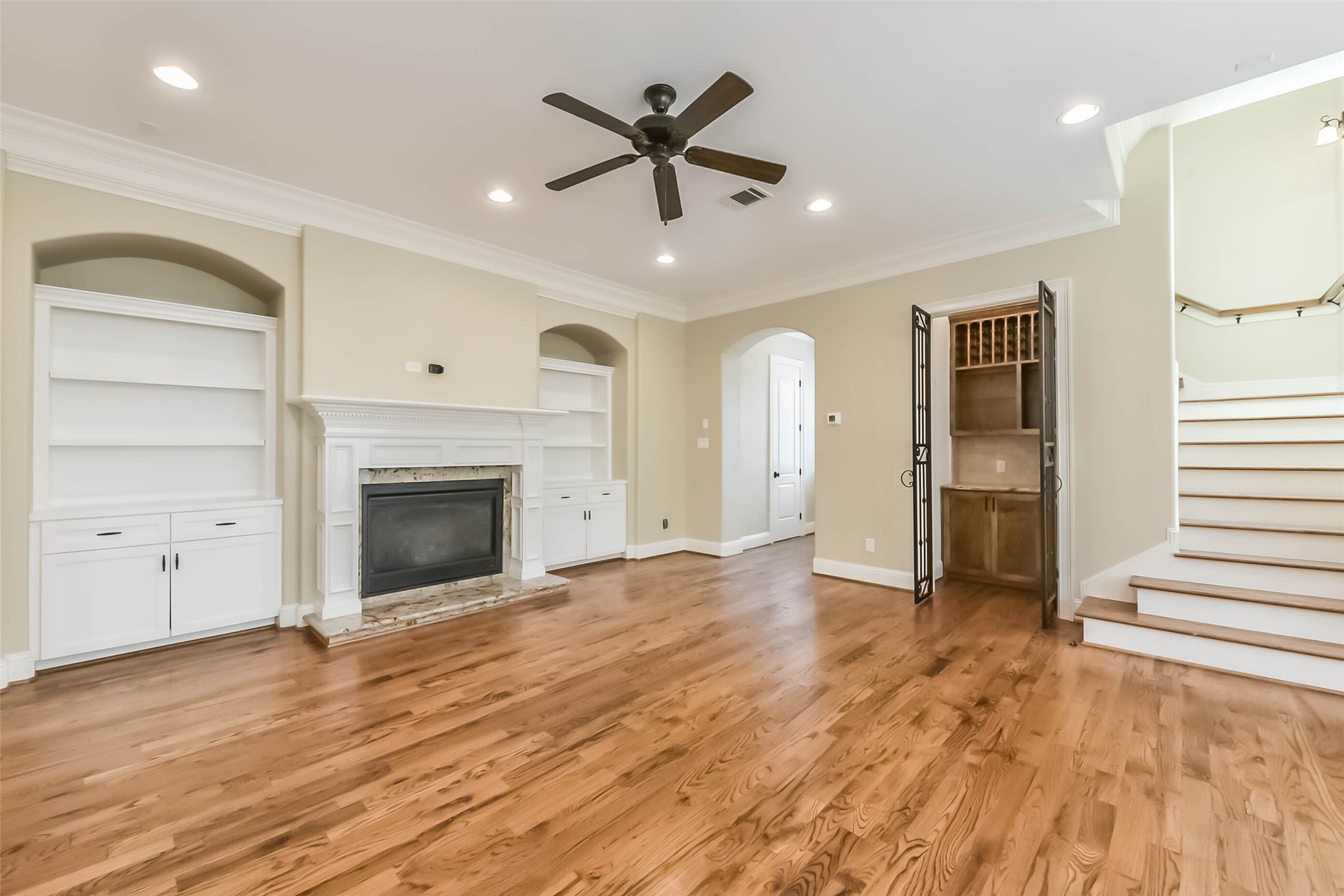 1126 West 16th Street, Unit C Houston, TX 77008 - Photo 15 of 44 a view of an empty room with a fireplace and a window
