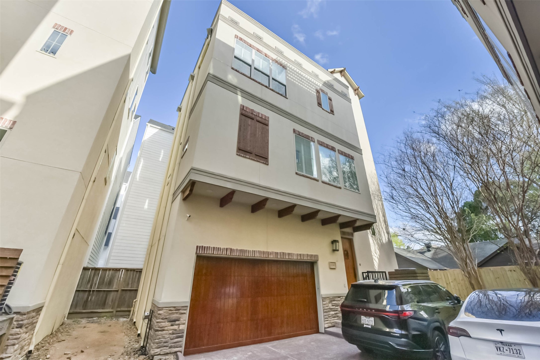 1126 West 16th Street, Unit C Houston, TX 77008 - Photo 2 of 44 a front view of a building with multiple parked cars