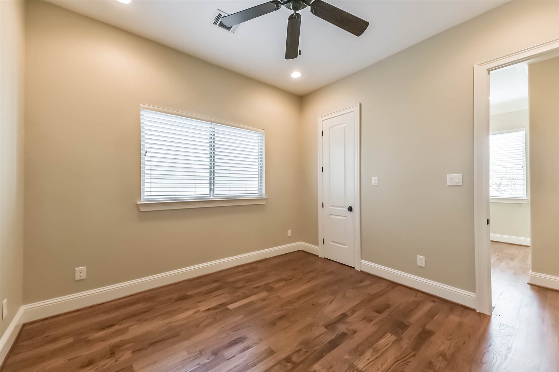 1126 West 16th Street, Unit C Houston, TX 77008 - Photo 35 of 44 a view of an empty room with wooden floor and a window