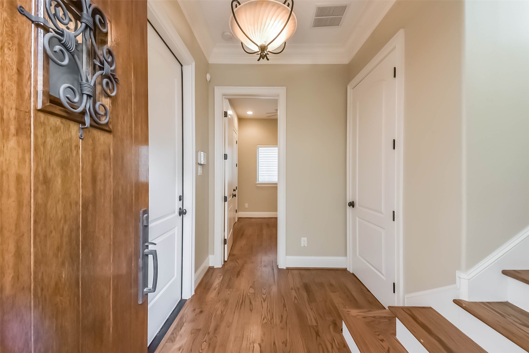 1126 West 16th Street, Unit C Houston, TX 77008 - Photo 7 of 44 a view of a hallway with wooden floor and staircase
