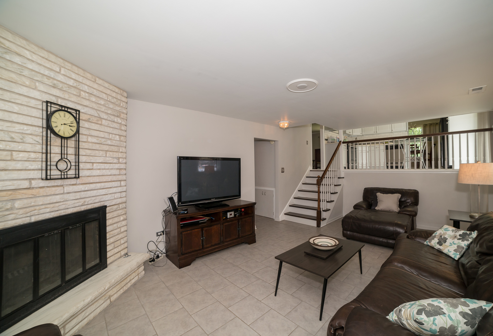 1258 Elder Road Homewood, IL 60430 - Photo 15 of 18 a living room with furniture and a flat screen tv