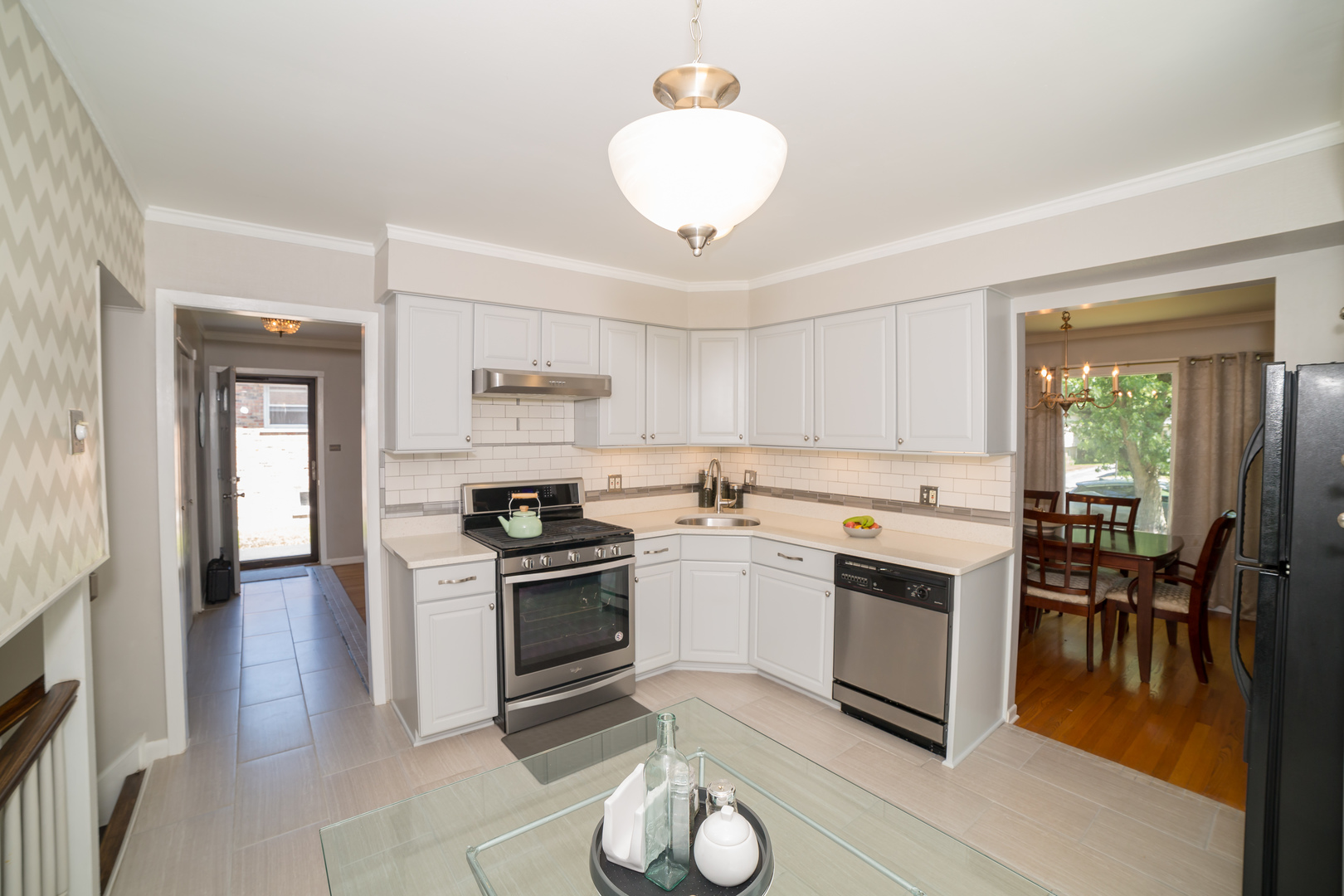 1258 Elder Road Homewood, IL 60430 - Photo 9 of 18 a kitchen with granite countertop a stove cabinets and stainless steel appliances