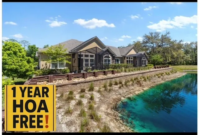 a view of house with outdoor space and sitting area