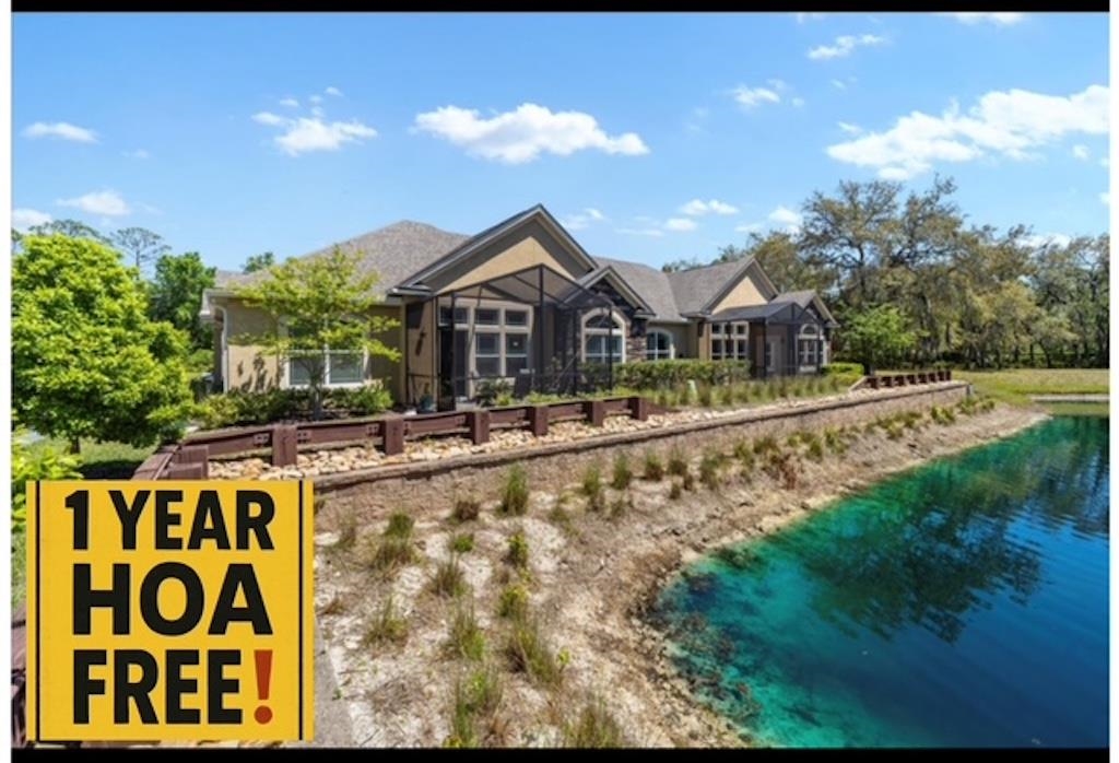 a view of house with outdoor space and sitting area