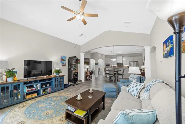 a living room with furniture and a flat screen tv