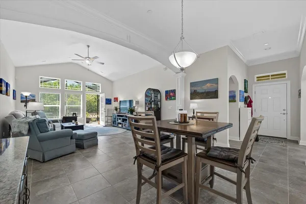 a view of a dining room with furniture window and outside view