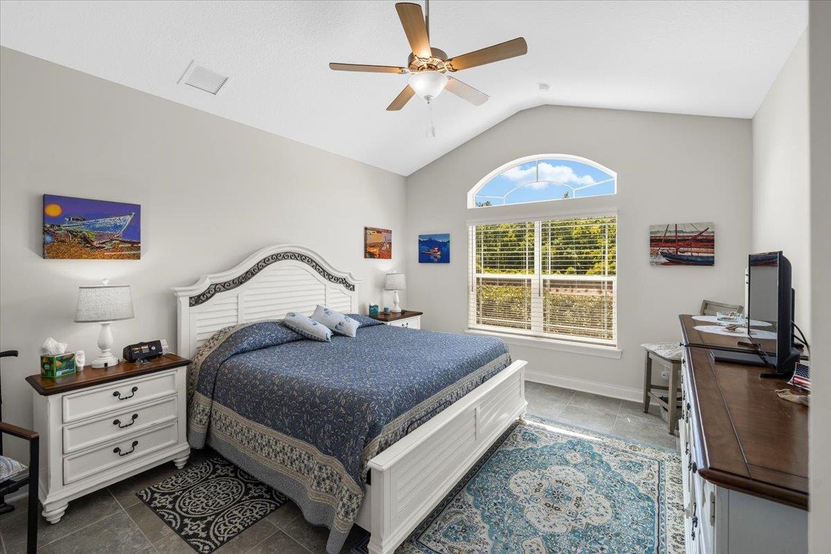 35 Timoga Trail St. Augustine, FL 32084 - Photo 21 of 52 a bedroom with a bed and a window