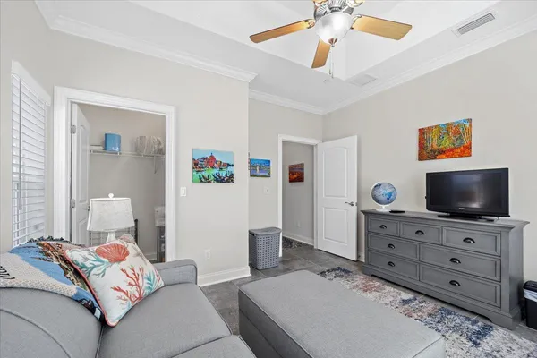 a large white kitchen with cabinets