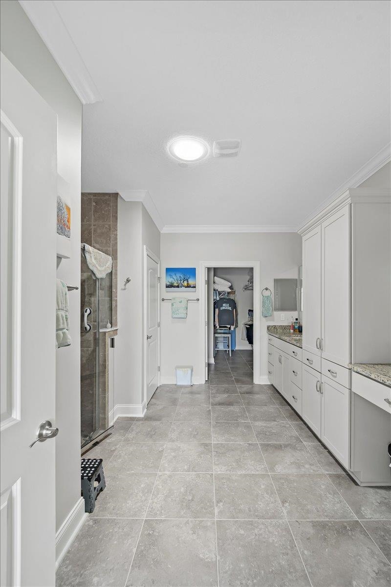 35 Timoga Trail St. Augustine, FL 32084 - Photo 25 of 52 a large white kitchen with cabinets