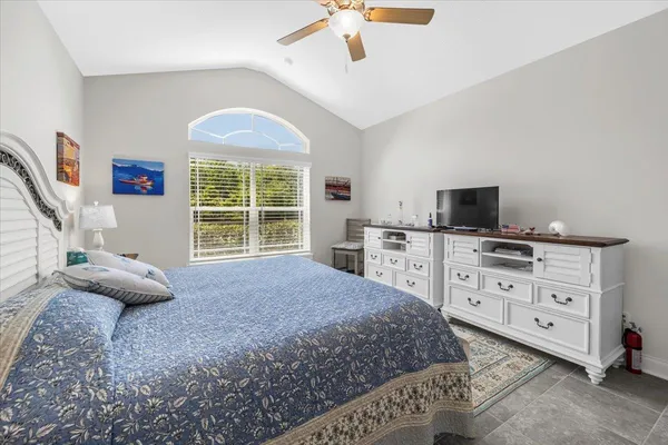 a large bathroom with a granite countertop double vanity sink and a mirror
