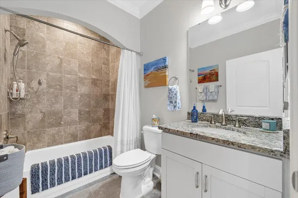 a view of a balcony with dining table chairs and a potted plant
