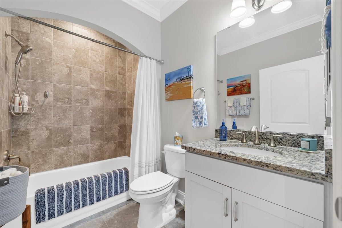 35 Timoga Trail St. Augustine, FL 32084 - Photo 35 of 52 a bathroom with a granite countertop sink a toilet a mirror and bathtub