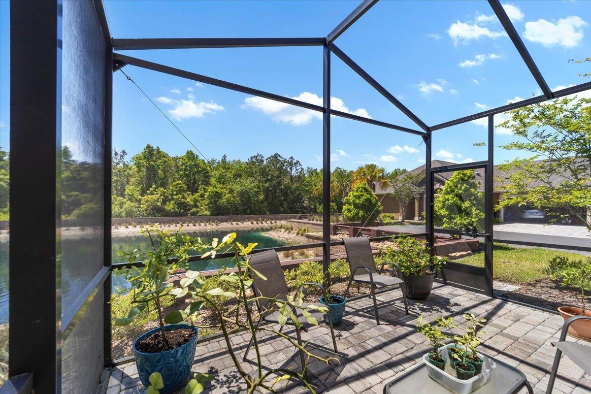 35 Timoga Trail St. Augustine, FL 32084 - Photo 39 of 52 a view of a balcony with dining table chairs and a potted plant