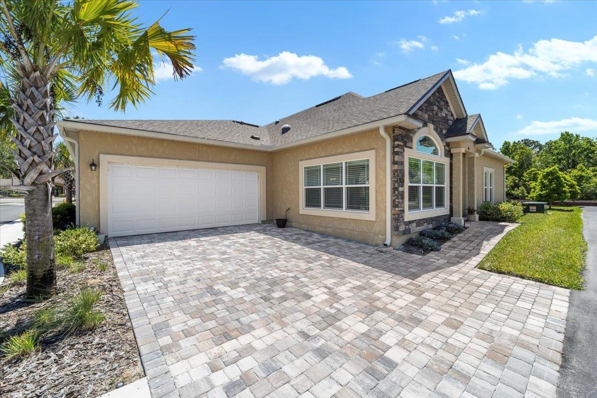 35 Timoga Trail St. Augustine, FL 32084 - Photo 45 of 52 a front view of a house with a yard and garage