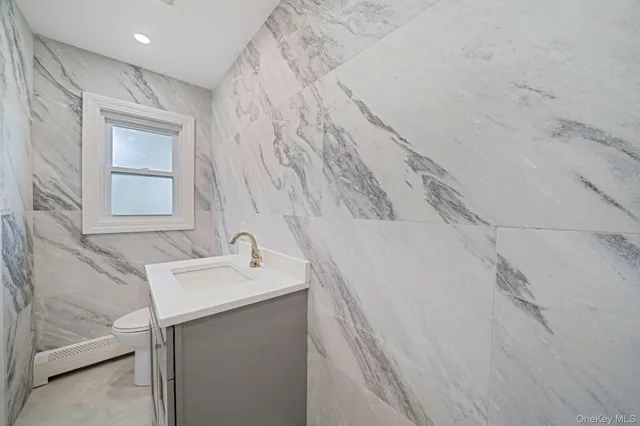 a bathroom with a sink and vanity
