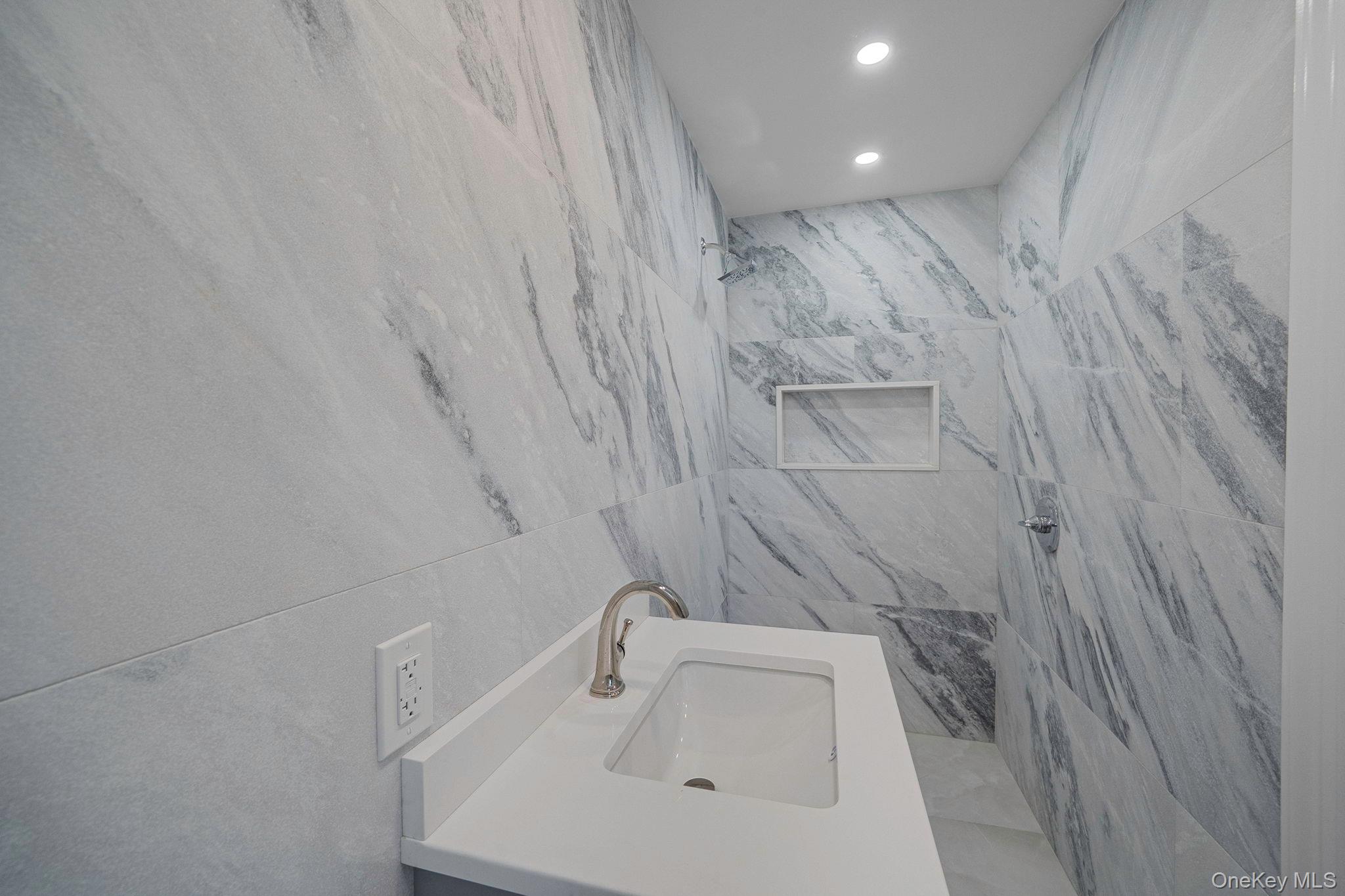 827 Aberdeen Road Bay Shore, NY 11706 - Photo 21 of 40 a bathroom with a sink and vanity