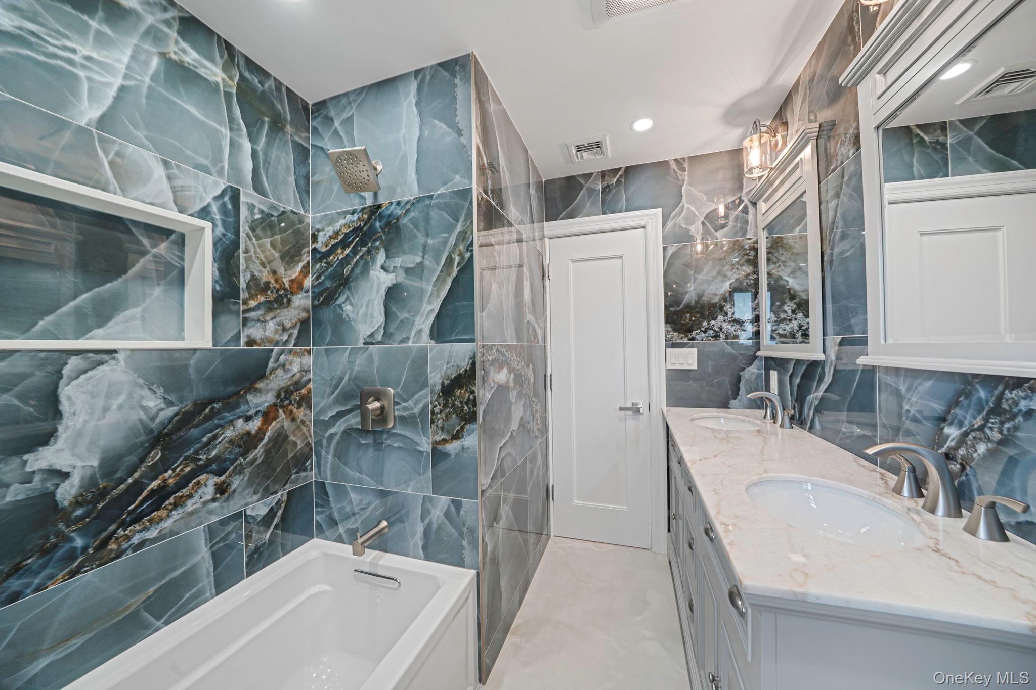 827 Aberdeen Road Bay Shore, NY 11706 - Photo 24 of 40 a bathroom with a sink a toilet and shower