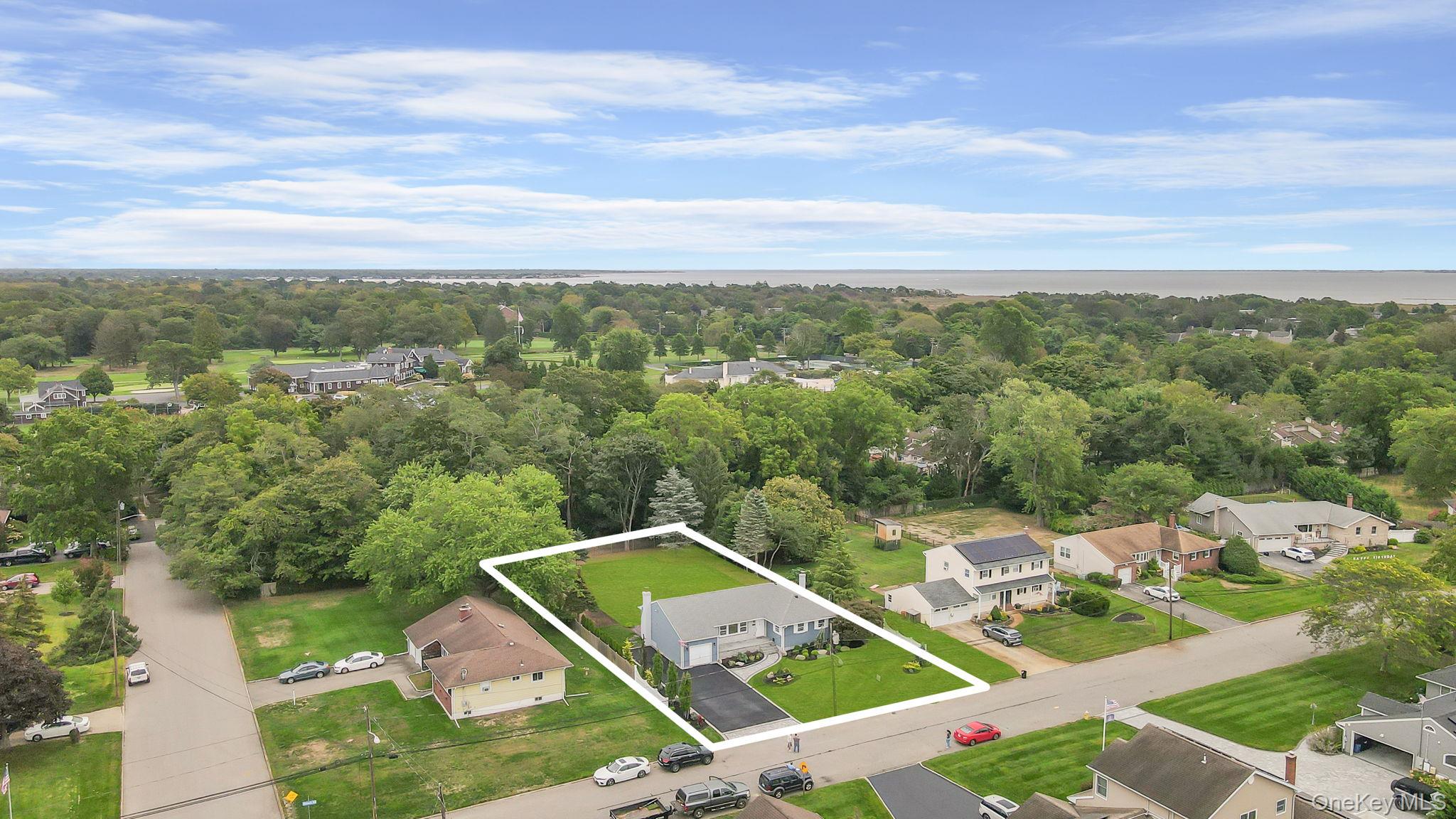 827 Aberdeen Road Bay Shore, NY 11706 - Photo 6 of 40 an aerial view of residential houses with outdoor space