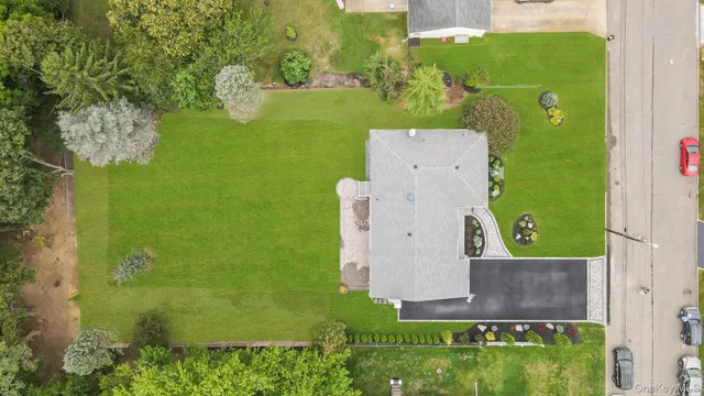 an aerial view of a house with a garden
