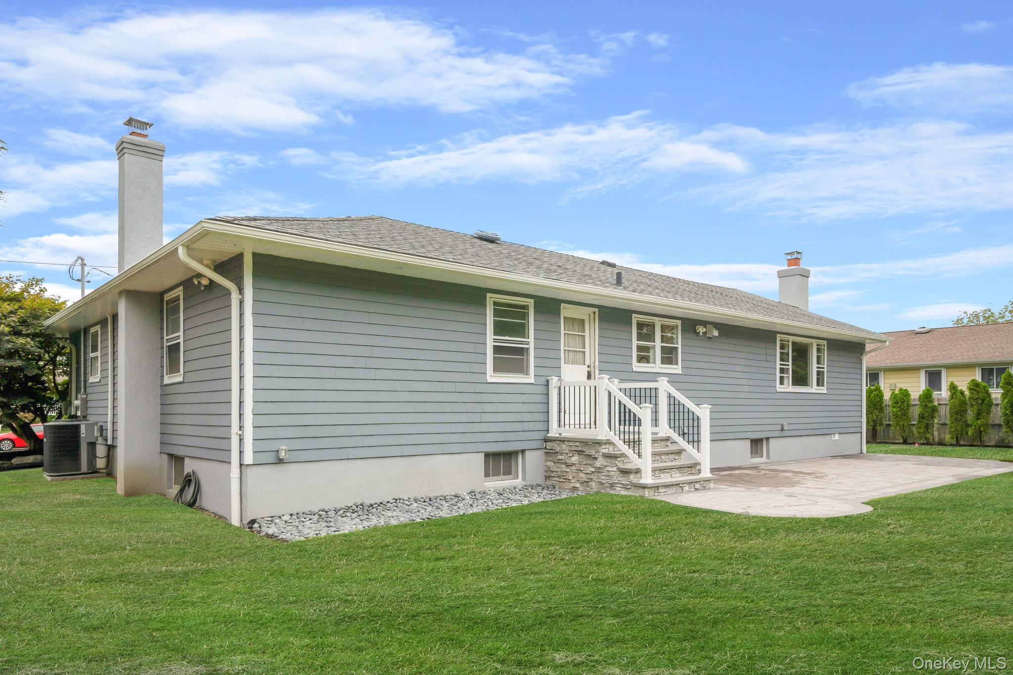 827 Aberdeen Road Bay Shore, NY 11706 - Photo 8 of 40 a front view of house with yard and outdoor seating