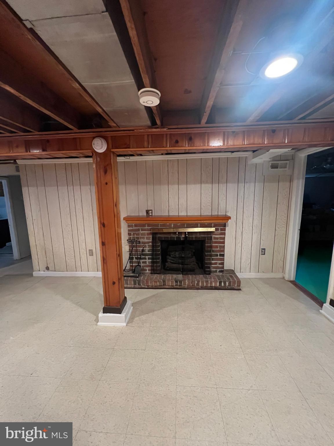 2518 Linwood Road Parkville, MD 21234 - Photo 23 of 27 a view of an empty room with a fireplace