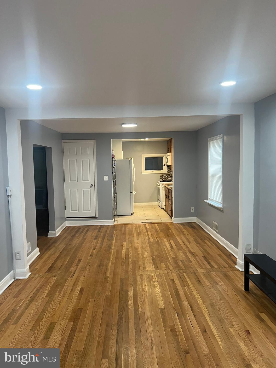2518 Linwood Road Parkville, MD 21234 - Photo 4 of 27 a view of empty room with wooden floor and fan