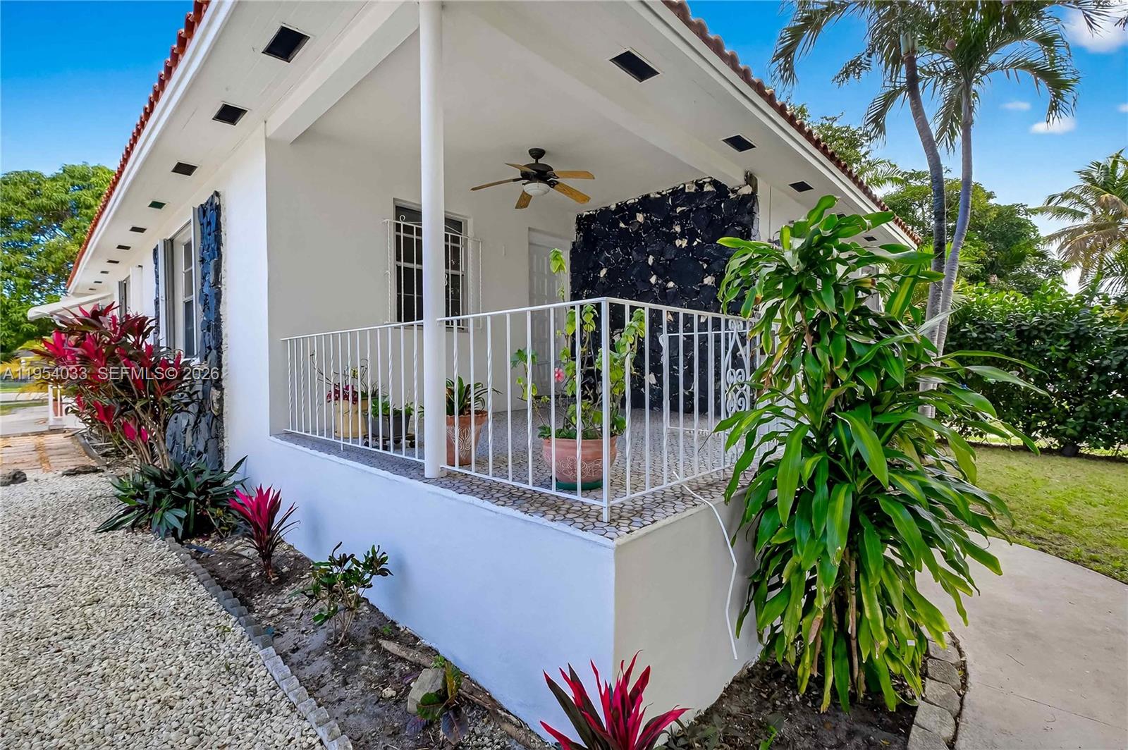 2399 Southwest 26th Lane Miami, FL 33133 - Photo 32 of 39 a balcony with flower in a pot