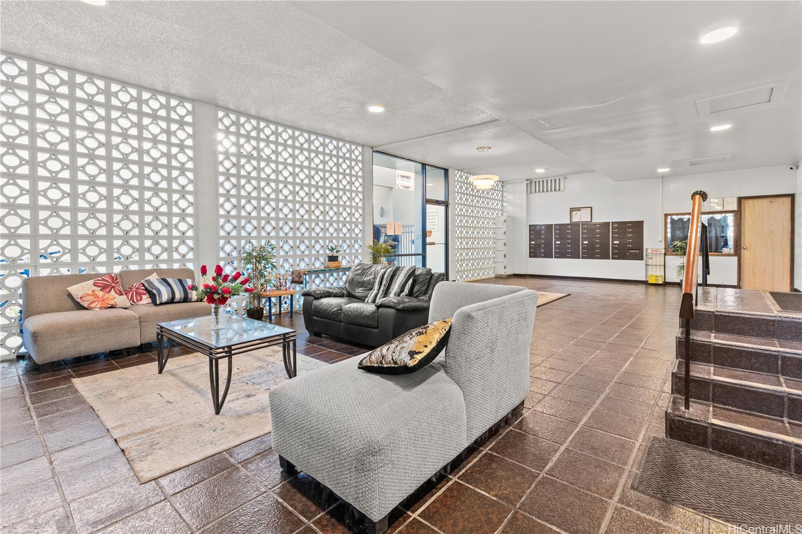 1069 Spencer Street, Unit 101 Honolulu, HI 96822 - Photo 18 of 19 a living room with furniture and a couch