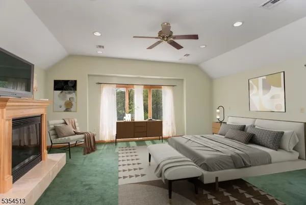 a bedroom with a bed and a fireplace