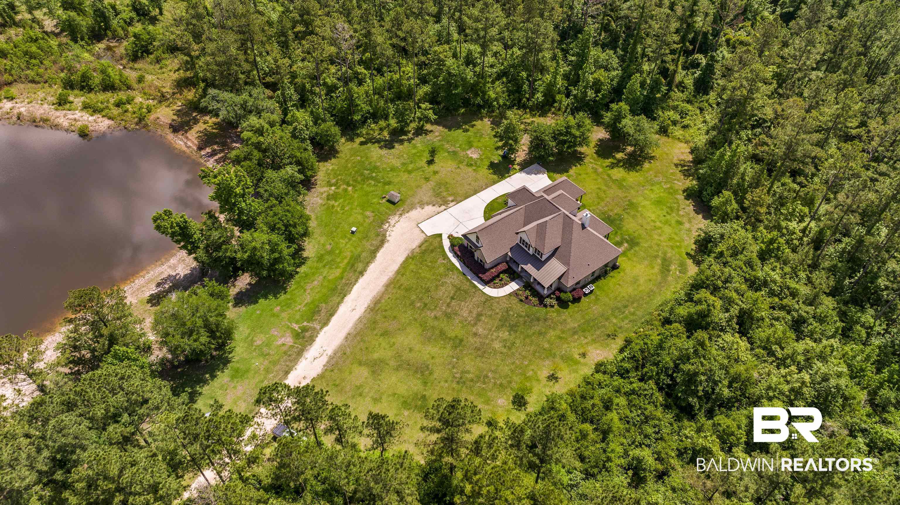 36784 Legacy Way Bay Minette, AL 36507 - Photo 50 of 57 View from above of property with a large body of water and a forest