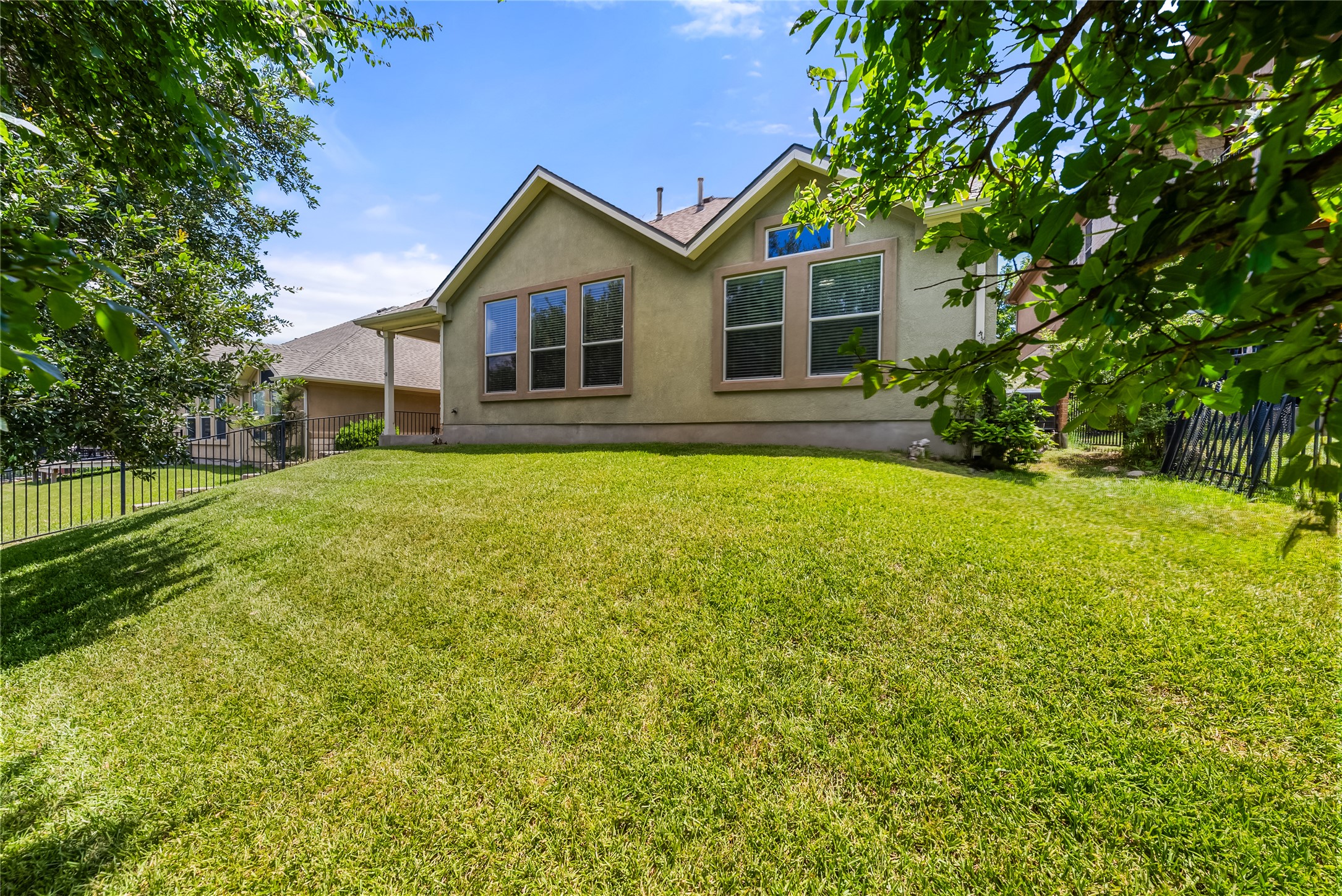 24 Stone Terrace Drive Austin, TX 78734 - Photo 4 of 32 a front view of a house with yard and green space