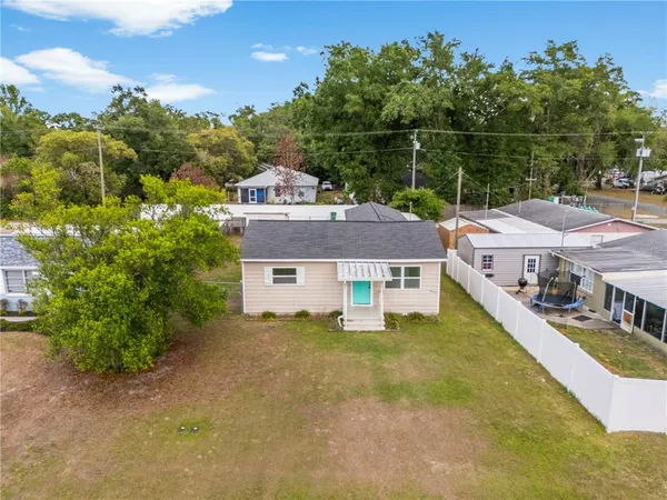a aerial view of a house with a yard