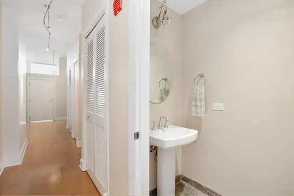 a bathroom with a sink and mirror