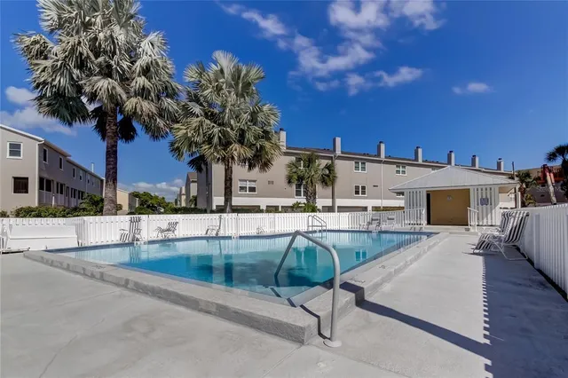 a view of a swimming pool with a patio