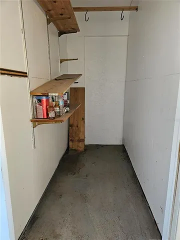a view of storage and utility room with washer and dryer