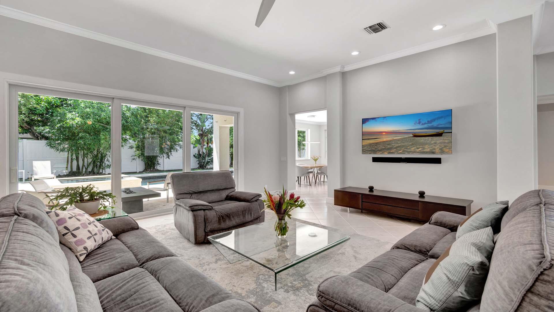 514 Northwest 13th Street Delray Beach, FL 33444 - Photo 13 of 35 a living room with furniture and a flat screen tv