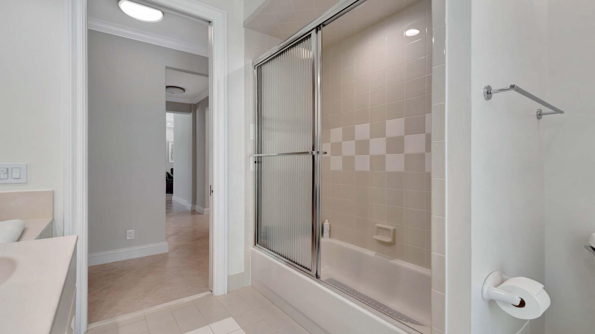 514 Northwest 13th Street Delray Beach, FL 33444 - Photo 24 of 35 a bathroom with a shower and a tub