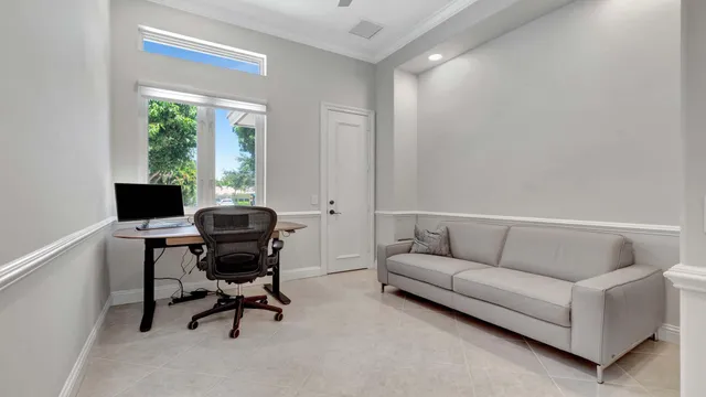 a bedroom with a bed a table and a window