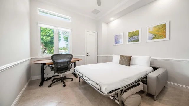 a living room with furniture and a book shelf