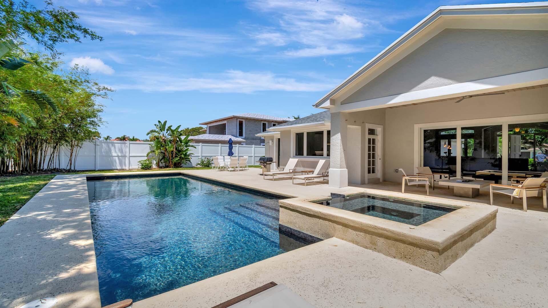 514 Northwest 13th Street Delray Beach, FL 33444 - Photo 32 of 35 a view of a patio with swimming pool table and chairs