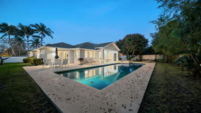 swimming pool view with a outdoor seating