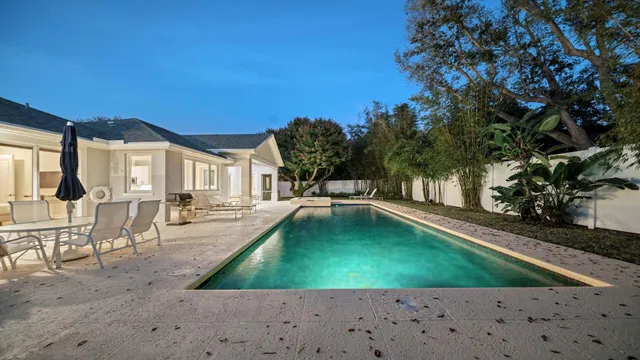 an aerial view of a house with a yard and garden