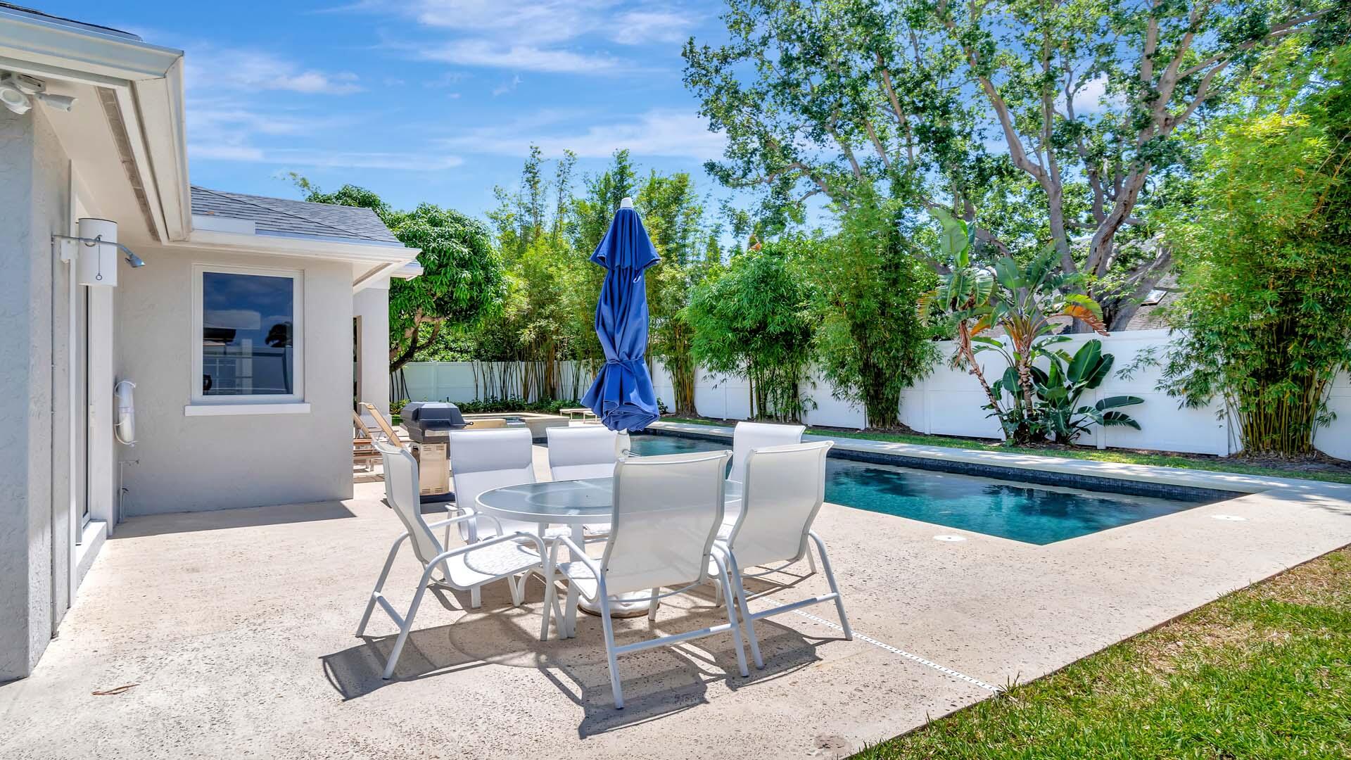 514 Northwest 13th Street Delray Beach, FL 33444 - Photo 10 of 35 a view of a patio with table and chairs and potted plants