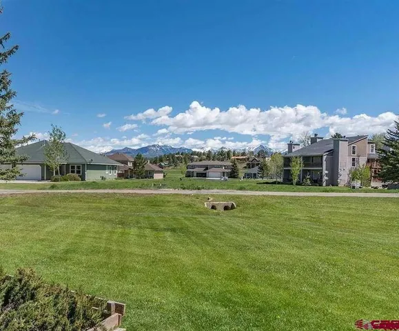 a view of a house with a big yard