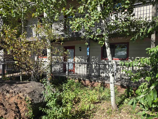 front view of a house with a small yard